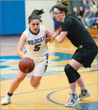  ?? SARAH GORDON/THE DAY ?? Old Lyme’s Emily Rivera (5) tries to drive around Valley Regional’s Carly Thompson during Tuesday night’s Shoreline Conference game in Old Lyme. The Wildcats rolled to a 55-25 win.