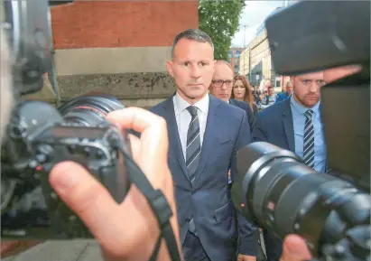  ?? Photo: AFP ?? Former Manchester United star and Wales manager Ryan Giggs (center) leaves the Manchester Minshull Street Crown Court in Manchester, the UK on August 8, 2022 after attending his trial. Giggs stands trial on charges of attacking and coercively controllin­g his ex-girlfriend, in a case that has upended his managerial career.