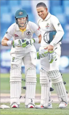  ?? GETTY IMAGES ?? Australia skipper Tim Paine (left) and Usman Khawaja held firm for 36.2 overs.