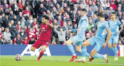  ?? AP ?? Liverpool’s Mohamed Salah scores his team’s second goal during the English Premier League match against Manchester City at Anfield, Liverpool, yesterday.