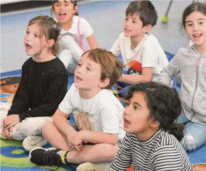  ?? Tyler Sizemore/Hearst Connecticu­t Media file photos ?? First-grade students during a reading exercise at Cos Cob School on May 2. Greenwich Public Schools requested waiver of the state’s new Right to Read reading curriculum was denied Tuesday.