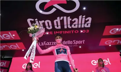  ??  ?? Italian time trial specialist Filippo Ganna, of Ineos Grenadiers, on the podium in Palermo after winning the first stage of the Giro d’Italia and taking the overall race lead. Photograph: Tim de Waele/Getty Images