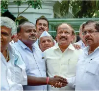  ?? PTI ?? HD Kumaraswam­y greets KPCC President G Parameshwa­ra after meeting the state governor in Bengaluru on Wednesday —