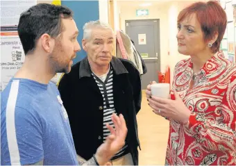  ??  ?? Chatty man Thomas Rowantree (left) and Jim McMillan explain to the government minister what work they do