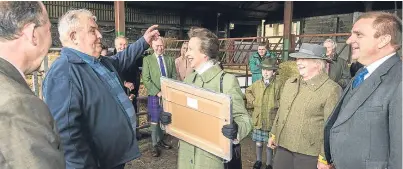  ?? Picture: Alan Richardson. ?? The Princess Royal presents Jake Fairley, retired cattleman at Hardiesmil­l, with a gift to mark his 64 years of service.