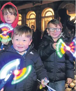  ?? Pictures: Tina Norris/Kim Cessford. ?? Kirkcaldy’s lights go on, while children enjoy St Andrew’s Day celebratio­ns in St Andrews.