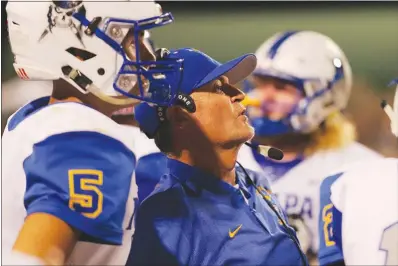  ?? WADE VANDERVORT ?? Moapa Valley coach Brent Lewis huddles with his team during a game in August at Green Valley High School. Lewis will lead the Pirates into a state semifinals game today against Northern Nevada powerhouse Truckee.