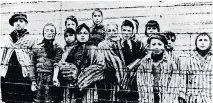  ?? THE ASSOCIATED PRESS FILES ?? A group of children are shown at Auschwitz after their liberation by the Soviet army in January 1945.