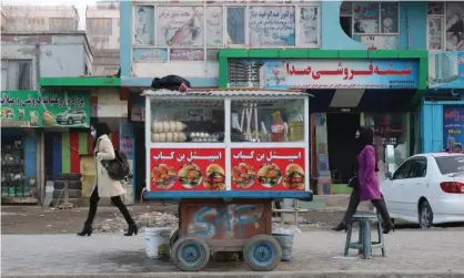  ?? Photograph: Anadolu Agency/Getty Images ?? Afghan women on a street in Kabul.