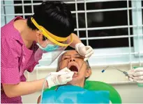  ??  ?? YANGON: Photo shows elderly resident of the "Twilight Villa" nursing home receiving free dental work at the center on the edge of Yangon.