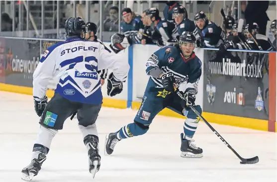  ?? Picture: Derek Black. ?? Dundee Stars’ Lukas Lundvald goes one-on-one with Lightning’s Evan Stoflet last night.