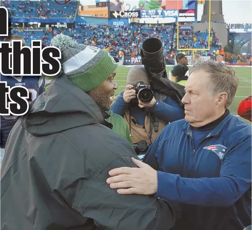  ?? STAFF PHOTO BY CHRIS CHRISTO ?? DIVISION RIVALS: Jets coach Todd Bowles and Pats counterpar­t Bill Belichick meet after their game in December.