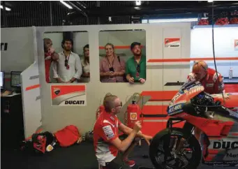  ??  ?? Clockwise from top: A pit walk on qualifying day has engineers busy prepping for that one hot lap. Jorge Lorenzo beams in a small press conference, confident in the speed of his bike on the weekend. Ducati Corse engineers discuss changes.