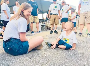  ?? RACHEL BUCK/COURTESY ?? Rachel Buck, a former University of New Haven cheerleade­r from Berlin, met 3-year-old Jacob Parry for the first time on Aug. 13 before a Worcester Braveheart­s baseball game. Buck had donated bone marrow to Parry, who was diagnosed with acute myeloid leukemia when he was a year old, through Be The Match, a national bone marrow registry.