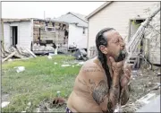  ?? ERIC GAY / AP ?? Bob Campbell bathes using a makeshift shower in Port Aransas, Texas. The Federal Emergency Management Agency is considerin­g mobile homes to shelter those whose homes have been destroyed or remain too dangerous to live in by Tropical Storm Harvey.