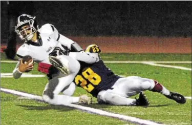  ?? STAN HUDY - SHUDY@DIGITALFIR­STMEDIA.COM ?? The Troy High defense held Shenendeho­wa quarterbac­k Brendan Belott to just 8-of-29 passes in semifinal in Troy, seen here sacked by Flying Horse linebacker Luis Virola. Friday’s Class AA