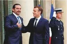  ?? Reuters ?? On Saturday, Macron hosted Lebanese Prime Minister Sa’ad Hariri for talks aimed at trying to resolve the crisis triggered by Hariri’s shock decision to resign.