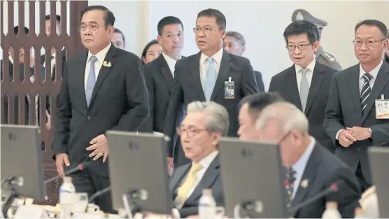  ?? CHANAT KATANYU ?? Prime Minister and Defence Minister Prayut Chan-o-cha, left, heads the first meeting of economic ministers to roll out stimulus measures to boost the sluggish economy at Government House.