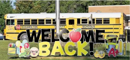  ?? STAFF PHOTO BY C.B. SCHMELTER ?? A “welcome back!” sign sits in the grass at Hixson Elementary School on the first day of school Wednesday in Hixson.