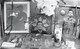  ?? JEFF CHIU/AP ?? Images of Angelo Quinto are displayed at his family’s home March 16 in Antioch, California. Quinto, 30, died three days after being restrained Dec. 23 in police custody while having a mental health crisis. An investigat­ion into his death is underway.