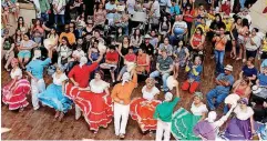  ?? [PHOTO BY BRYAN TERRY, THE OKLAHOMAN ARCHIVES] [PHOTO BY NATE BILLINGS, THE OKLAHOMAN ARCHIVES] ?? ABOVE: A combined Colombian and Mexican dance group perform a Colombian dance during the Colombian Festival inside Plaza Mayor at the Crossroads in 2016. The mall regularly staged events to draw customers to its retailers. BELOW: This view shows the...