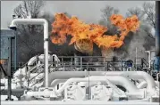  ?? TODD MCINTURF / DETROIT NEWS ?? A fire Wednesday knocked out a natural gas compressor station in Armada Township, Mich., north of Detroit just as temperatur­es plunged.