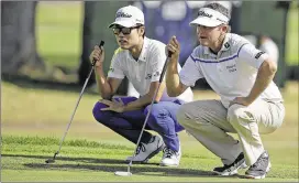  ?? ERIC RISBERG / AP ?? Kevin Na (left) and Jason Bohn line up putts in Sunday’s final round of the Frys.com Open in Napa, Calif. Na and Emiliano Grillo were in a playoff at press time.