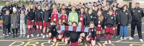  ??  ?? These Dryburgh Athletic players took part in two Scottish Cup games in Glasgow. They are pictured with supporters who also made the trip.