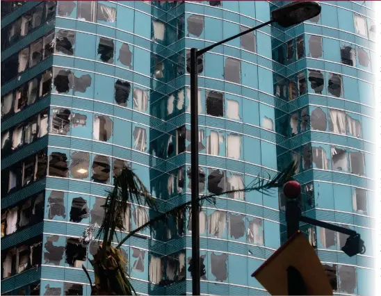  ?? Photo: AFP ?? Windows of a commercial building in Hong Kong are blown out during Super Typhoon Mangkhut on Sunday.