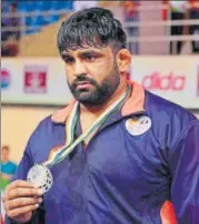  ?? PTI ?? India’s Sumit Malik claimed silver in the 125kg division on the final day of the Asian Championsh­ips in New Delhi on Sunday.