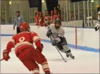  ?? THOMAS NASH — DIGITAL FIRST MEDIA ?? Hill School’s Ethan Hempel (3) takes the puck into the zone while Lawrencevi­lle’s David Zhu (8) defends during Saturday’s game.