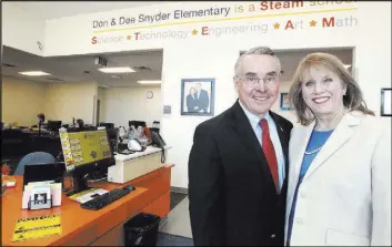  ?? K.M. Cannon Las Vegas Review-Journal @KMCannonPh­oto ?? Don and Dee Snyder in the front office of their namesake elementary school, which will be dedicated March 20.