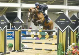  ??  ?? Paul Barker and Happy Boy triumph in the hard-fought National 1.40m