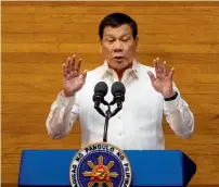  ?? AFP ?? President Rodrigo Duterte gestures as he delivers his state of the nation address at Congress in Manila. —