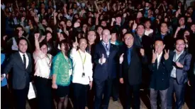  ??  ?? Students and officials of Saint Louis University join Ambassador Pruce for a group photo after the program