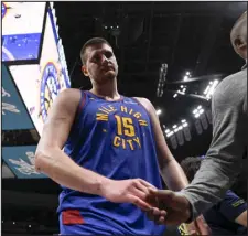  ?? AARON ONTIVEROZ — THE DENVER POST ?? Denver’s Nikola Jokic leaves the court after overtime of the Phoenix Suns’ 117-107win at Ball Arena on Tuesday.