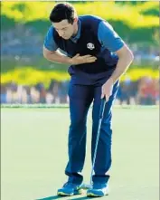 ?? Andrew Redington Getty Images ?? RORY McILROY takes a bow after making an eagle putt on the 16th hole to clinch his four-ball match.