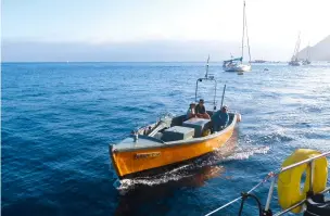  ??  ?? Water taxi ashore for a visit to Jamestown, Saint Helena (right)