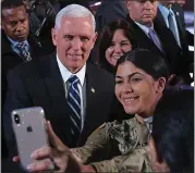  ?? SEAN GALLUP — GETTY IMAGES ?? Vice President Mike Pence and his wife, Karen, pose for a selfie while visiting Polish and U.S. soldiers Wednesday.