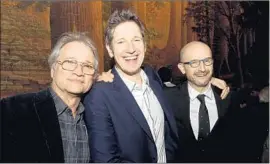  ?? Kevin Winter Getty Images ?? SCREEN GEMS President Clint Culpepper, left, with writer/director Paul W.S. Anderson and producer Jeremy Bolt. Culpepper has focused on lower-budget comedies, horror movies and films targeting African American audiences.