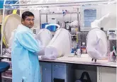  ?? COURTESY OF LANL ?? Anand Kumar works with a biosafety level 2 facility at Los Alamos studying Clostridiu­m difficile bacteria, a serious health threat worldwide. Kumar, an Entreprene­urial Fellow at Los Alamos National Laboratory, is a member of the lab’s Biosecurit­y and...