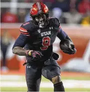  ?? RICK BOWMER / AP 2022 ?? Running back Tavion Thomas, a Dunbar High School grad and former Cincinnati Bearcat, ran for 28 touchdowns in two seasons at Utah.