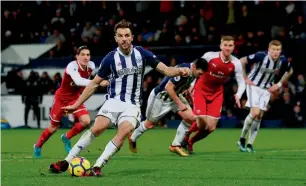  ?? — Reuters ?? West Bromwich Albion’s Jay Rodriguez scores from the penalty spot against Arsenal.