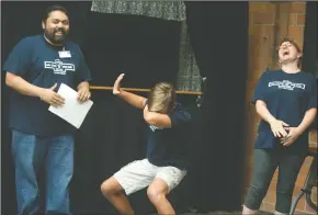  ??  ?? Above: Instructor­s Jateen and Claire Bhakta laugh as Jessie Jay, 14, poses while receiving his certificat­e on the last day of camp. Left: Mom Lenor Mier looks on as Gabriella Mier, 3, tries out her brother Jorge Mier’s game. Campers designed and coded...