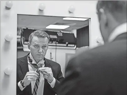  ?? [ALEXANDER ZEMLIANICH­ENKO/THE ASSOCIATED PRESS] ?? Russian opposition politician Alexei Navalny prepares for his interview with The Associated Press in Moscow.