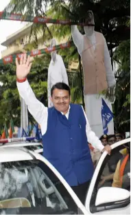  ?? — DEBASISH DEY ?? Chief minister Devendra Fadnavis celebrates his party’s win in Assembly elections outside BJP head office in Mumbai.
