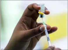  ?? GRAHAM HUGHES — THE CANADIAN PRESS VIA AP, FILE ?? A health care worker prepares a monkeypox vaccine in Montreal, Saturday, July 23, 2022. Nearly 800,000doses of the monkeypox vaccine will soon be available for U.S. distributi­on, U.S. health regulators said on Wednesday.