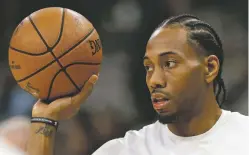  ?? AP FILE PHOTOS ?? Two people familiar with the situation say San Antonio and Toronto have reached an agreement in principle on a trade that will send Kawhi Leonard, above, to the Raptors and DeMar DeRozan, right, to the Spurs. One of the people says the Spurs also are sending Danny Green to the Raptors as part of the deal.