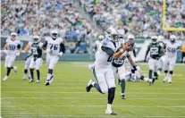  ?? JULIE JACOBSON/ASSOCIATED PRESS FILE PHOTO ?? Titans quarterbac­k Marcus Mariota catches a pass in 2015 against the Jets in East Rutherford, N.J. For every unplanned play that earns a name like the Immaculate Reception, there’s a gimmick cooked up by coaches to catch a defense by surprise.