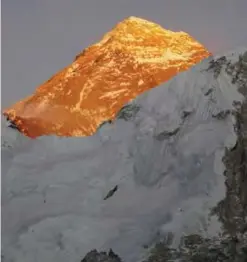  ?? —AP ?? NEPAL: In this file photo, Mt Everest is seen from the way to Kalapattha­r in Nepal.